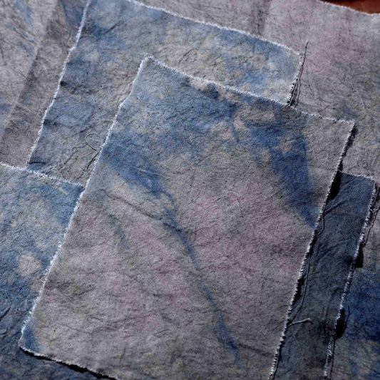 Handmade tie-dyed purple fabric scraps resembling a witch's witch - vintage-style journal collage decoration and photo backdrop.