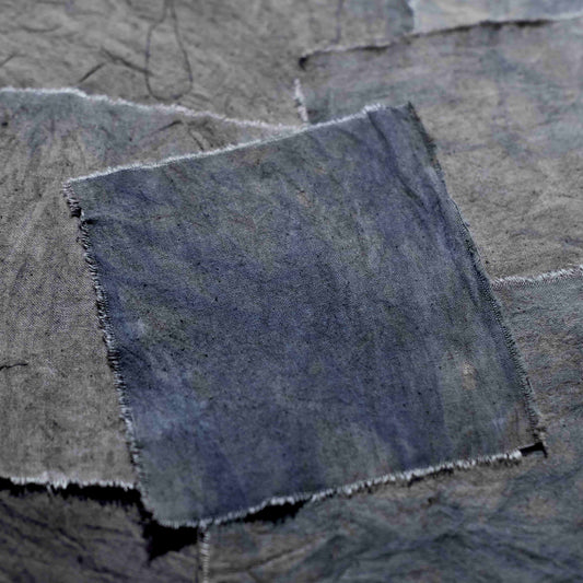 Handmade tie-dyed purple fabric scraps resembling a witch's witch - vintage-style journal collage decoration and photo backdrop.