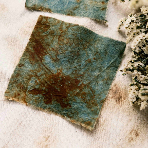 Handmade tie-dyed rust-colored distressed blue-green vintage decorative fabric for journal DIY collage