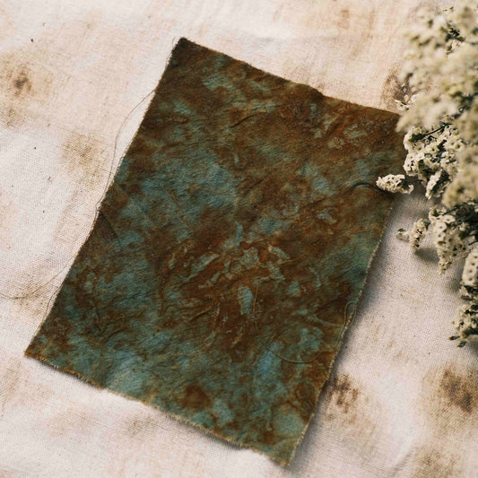 Handmade tie-dyed rust-colored distressed blue-green vintage decorative fabric for journal DIY collage