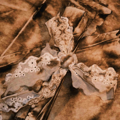 Vintage-style distressed and tattered fabric, suitable for art journaling, DIY collage, and wasteland-themed photo backdrops.
